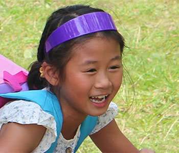 young girl playing outside